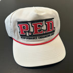 White cap with red and black 'P.E.D.' logo on a dark background
